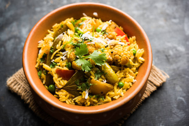 istock Masala Rice or masale bhat - is a spicy vegetable fried rice / biryani or Pulav usually made during wedding occassions in maharashtra, India 1084191494