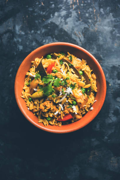 istock Masala Rice or masale bhat - is a spicy vegetable fried rice / biryani or Pulav usually made during wedding occassions in maharashtra, India 1084192588