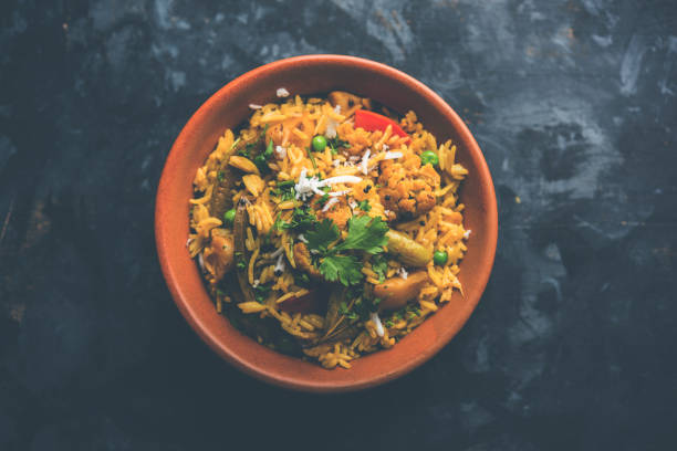 istock Masala Rice or masale bhat - is a spicy vegetable fried rice / biryani or Pulav usually made during wedding occassions in maharashtra, India 1084192674