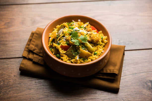 istock Masala Rice or masale bhat - is a spicy vegetable fried rice / biryani or Pulav usually made during wedding occassions in maharashtra, India 1084192710