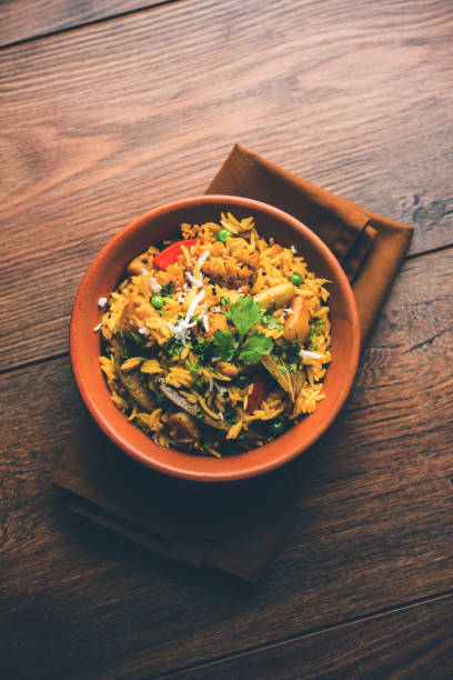 istock Masala Rice or masale bhat - is a spicy vegetable fried rice / biryani or Pulav usually made during wedding occassions in maharashtra, India 1084192748
