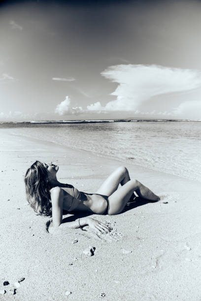 istock Slim woman enjoying on a sandy tropical beach. 1084193198