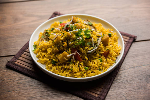 istock Masala Rice or masale bhat - is a spicy vegetable fried rice / biryani or Pulav usually made during wedding occassions in maharashtra, India 1084193434