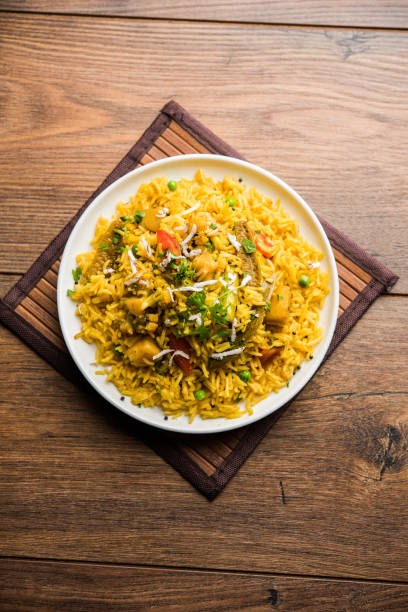 istock Masala Rice or masale bhat - is a spicy vegetable fried rice / biryani or Pulav usually made during wedding occassions in maharashtra, India 1084193482