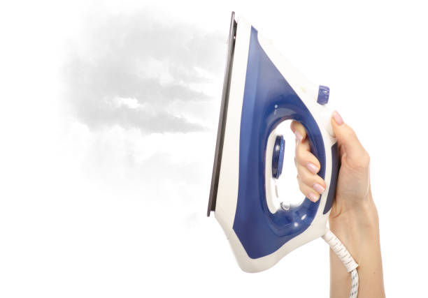 istock Blue iron steam in hand 1084193534