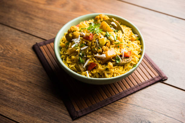 istock Masala Rice or masale bhat - is a spicy vegetable fried rice / biryani or Pulav usually made during wedding occassions in maharashtra, India 1084193660