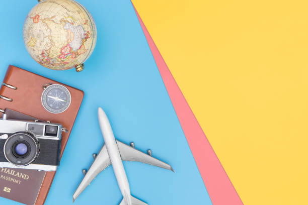 istock Travel accessories objects and gadgets top view flatlay on blue yellow 1084193766