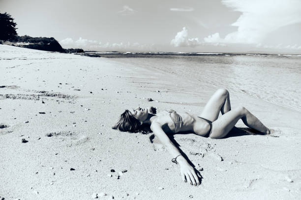 istock Slim woman enjoying on a sandy tropical beach. 1084193976