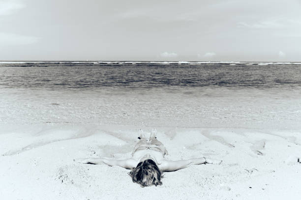 istock Slim woman enjoying on a sandy tropical beach. 1084195256