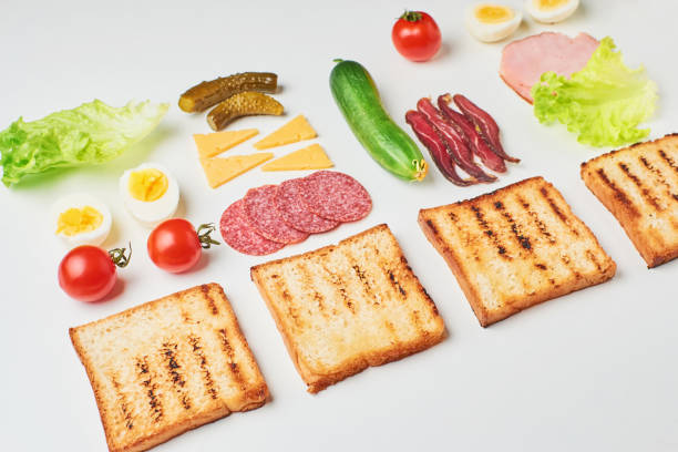 istock Sandwich ingredients on a white background, top view 1084195780