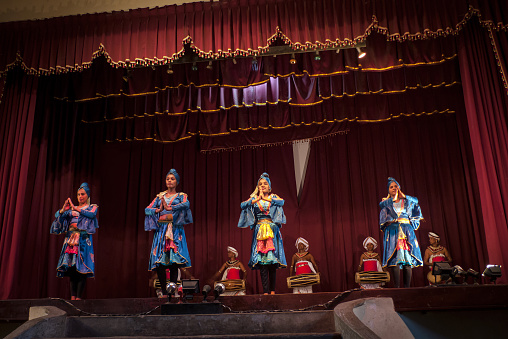 Kandy, Sri Lanka, 02/14/2014: a group of dancers and musicians from the Kandyan Arts Association performs dancing on the stage of the Kandyan cultural center