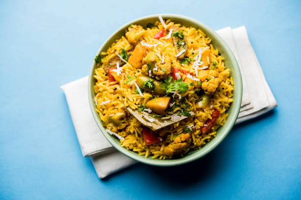 istock Masala Rice or masale bhat - is a spicy vegetable fried rice / biryani or Pulav usually made during wedding occassions in maharashtra, India 1084196066