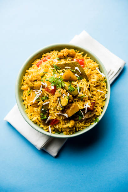 istock Masala Rice or masale bhat - is a spicy vegetable fried rice / biryani or Pulav usually made during wedding occassions in maharashtra, India 1084196272