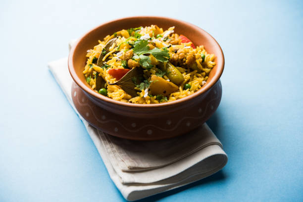 istock Masala Rice or masale bhat - is a spicy vegetable fried rice / biryani or Pulav usually made during wedding occassions in maharashtra, India 1084196606