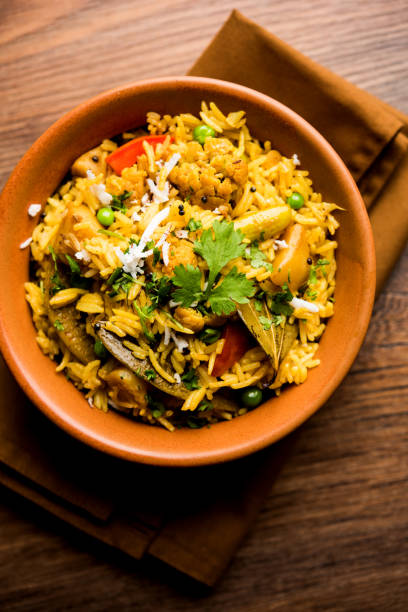 istock Masala Rice or masale bhat - is a spicy vegetable fried rice / biryani or Pulav usually made during wedding occassions in maharashtra, India 1084196752