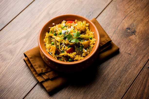 istock Masala Rice or masale bhat - is a spicy vegetable fried rice / biryani or Pulav usually made during wedding occassions in maharashtra, India 1084196870