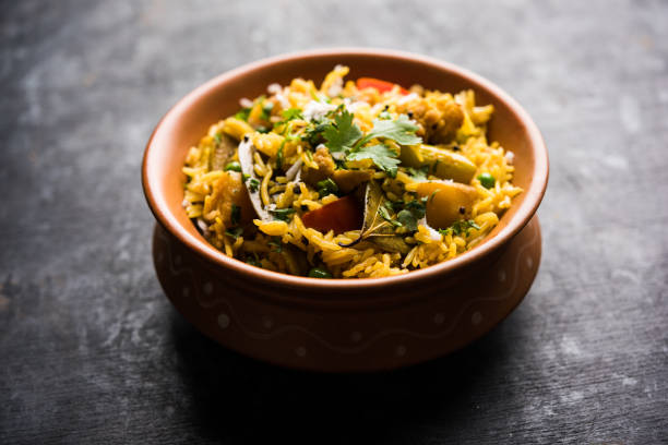 istock Masala Rice or masale bhat - is a spicy vegetable fried rice / biryani or Pulav usually made during wedding occassions in maharashtra, India 1084196906