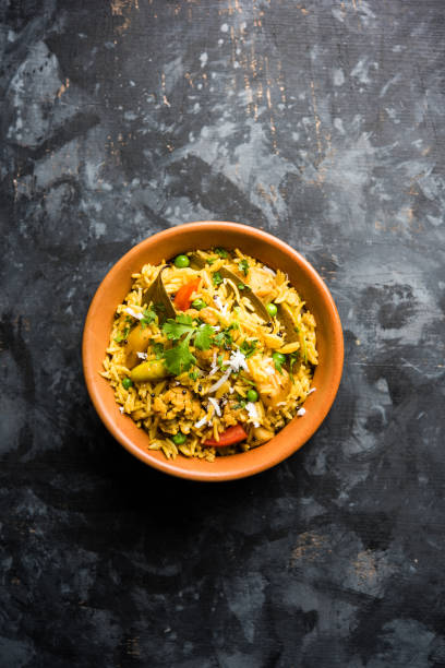 istock Masala Rice or masale bhat - is a spicy vegetable fried rice / biryani or Pulav usually made during wedding occassions in maharashtra, India 1084196966