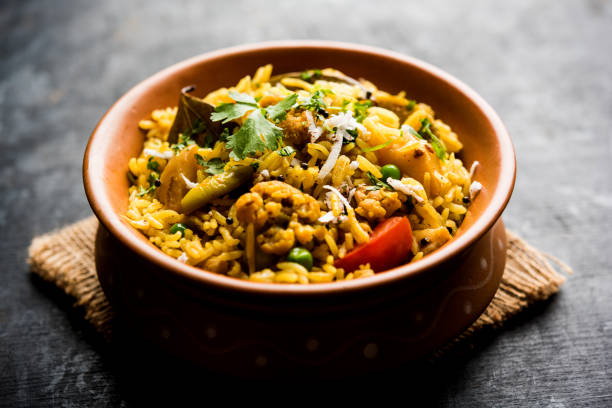 istock Masala Rice or masale bhat - is a spicy vegetable fried rice / biryani or Pulav usually made during wedding occassions in maharashtra, India 1084198070