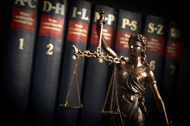 istock Statue of justice on books background 1084198134