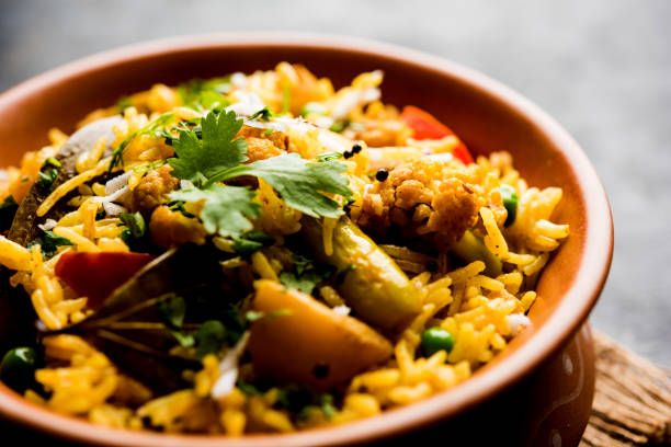 istock Masala Rice or masale bhat - is a spicy vegetable fried rice / biryani or Pulav usually made during wedding occassions in maharashtra, India 1084198178