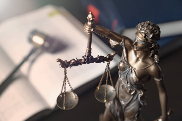 istock Statue of justice on books background 1084198214