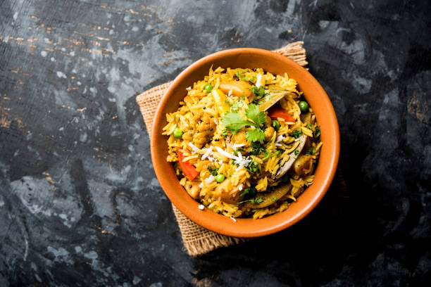 istock Masala Rice or masale bhat - is a spicy vegetable fried rice / biryani or Pulav usually made during wedding occassions in maharashtra, India 1084198254