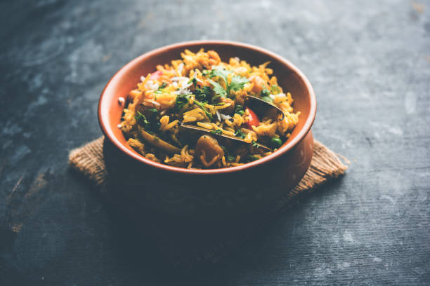 istock Masala Rice or masale bhat - is a spicy vegetable fried rice / biryani or Pulav usually made during wedding occassions in maharashtra, India 1084198356