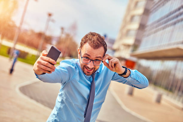 istock Businessman using his smartphone on the street. 1084198974