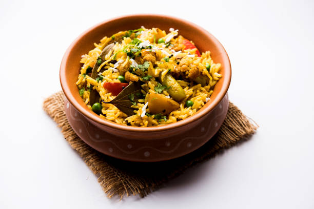istock Masala Rice or masale bhat - is a spicy vegetable fried rice / biryani or Pulav usually made during wedding occassions in maharashtra, India 1084199386