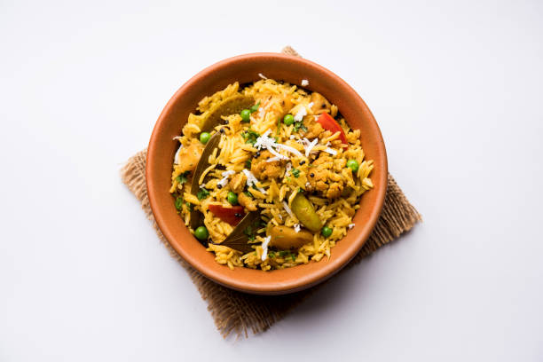istock Masala Rice or masale bhat - is a spicy vegetable fried rice / biryani or Pulav usually made during wedding occassions in maharashtra, India 1084199636