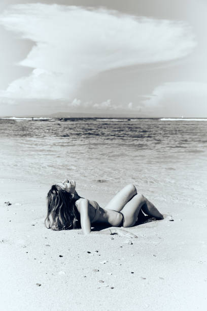 istock Slim woman enjoying on a sandy tropical beach. 1084199688