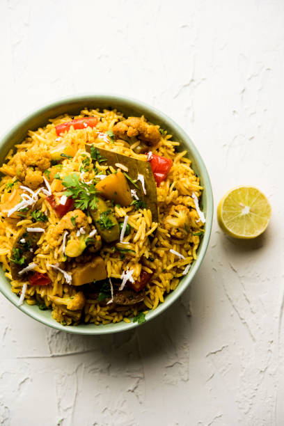 istock Masala Rice or masale bhat - is a spicy vegetable fried rice / biryani or Pulav usually made during wedding occassions in maharashtra, India 1084199758