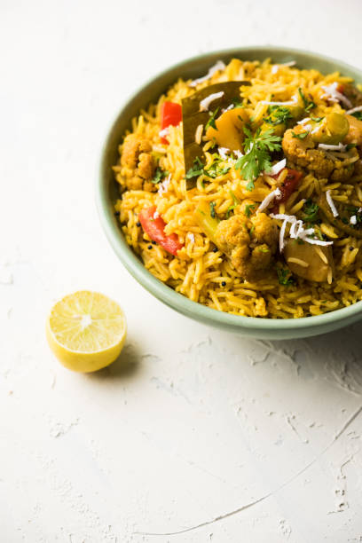 istock Masala Rice or masale bhat - is a spicy vegetable fried rice / biryani or Pulav usually made during wedding occassions in maharashtra, India 1084200056