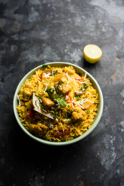 istock Masala Rice or masale bhat - is a spicy vegetable fried rice / biryani or Pulav usually made during wedding occassions in maharashtra, India 1084200122