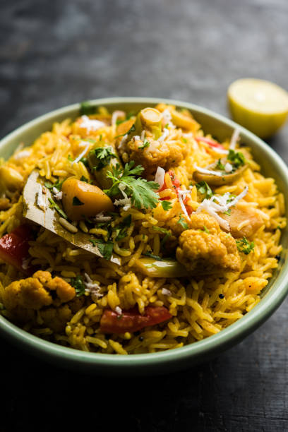 istock Masala Rice or masale bhat - is a spicy vegetable fried rice / biryani or Pulav usually made during wedding occassions in maharashtra, India 1084200270