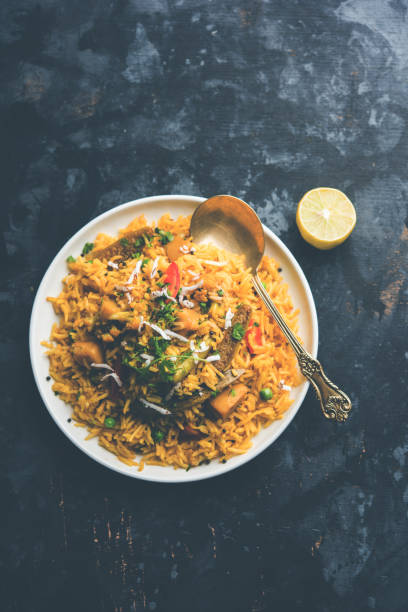istock Masala Rice or masale bhat - is a spicy vegetable fried rice / biryani or Pulav usually made during wedding occassions in maharashtra, India 1084201624