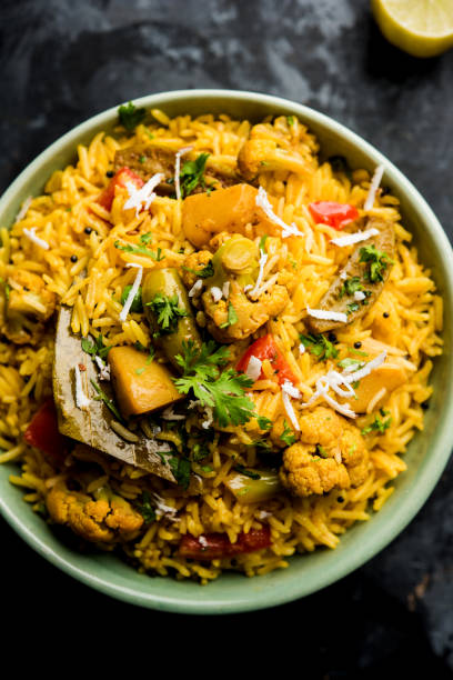 istock Masala Rice or masale bhat - is a spicy vegetable fried rice / biryani or Pulav usually made during wedding occassions in maharashtra, India 1084201790