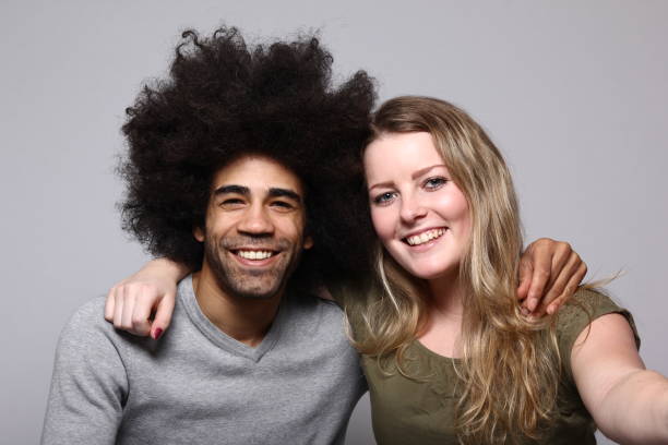 istock Afro man and caucasian woman 1084206302
