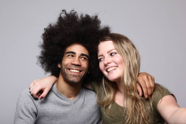 istock Afro man and caucasian woman 1084206310