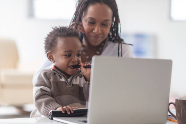 istock A mother works from home with her young son 1084210246