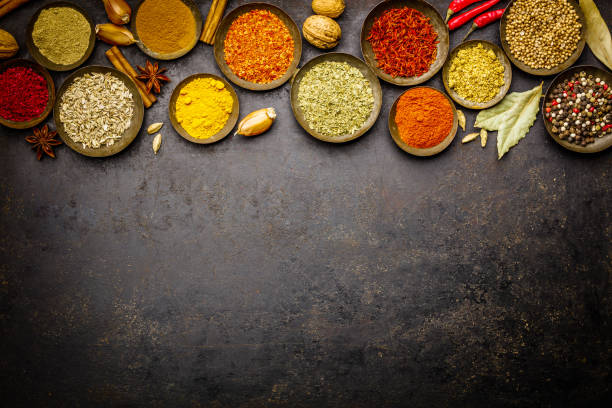 istock Various bowls of spices over dark background 1084210356