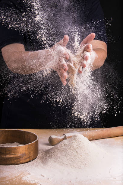 istock sift the flour for the homemade dough 1084210444