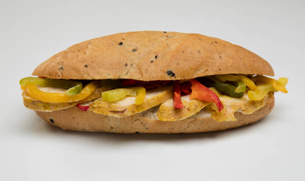 istock Chicken and Roasted Peppered Sandwich on white background 1084210564