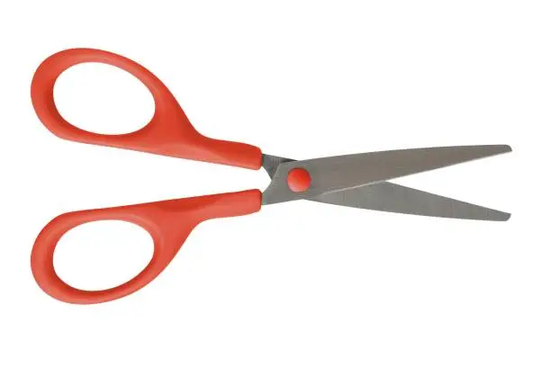 Photo of Open scissors on white