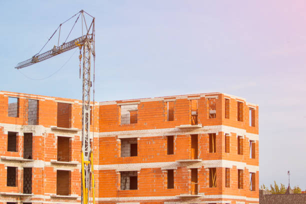 istock Building a house of red brick, toned 1084219540