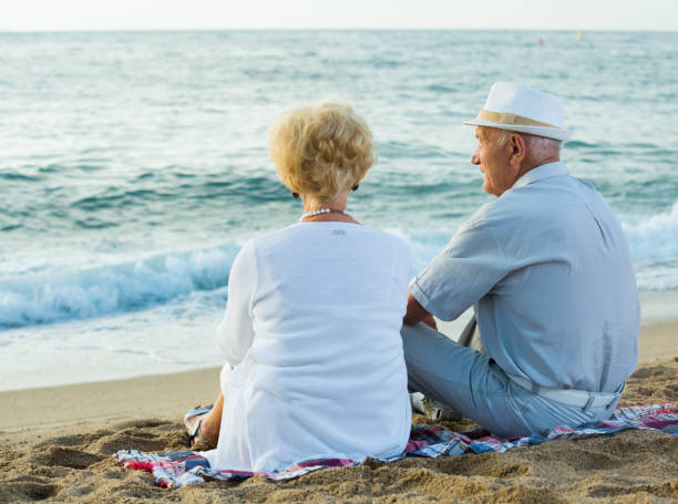 istock pensioners sitting back together at the sea 1084220978