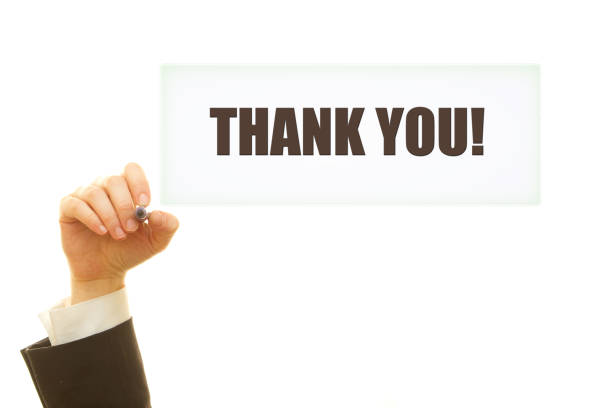 istock Woman hand writing Thank You message isolated on white. 1084221104