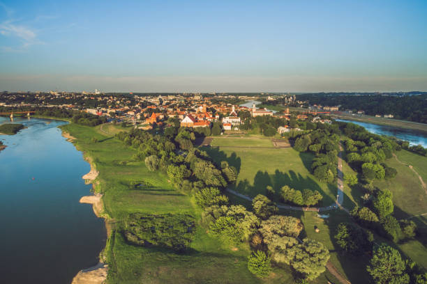 istock Aerial View Of River Amidst Cityscape 1084226404