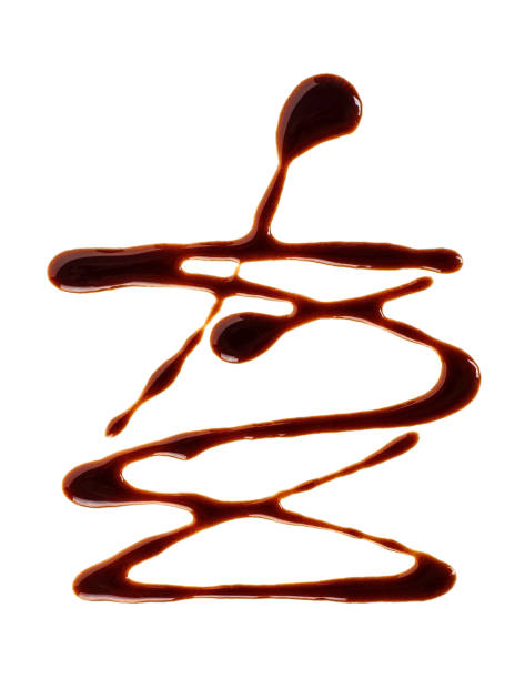 istock Sweet chocolate sauce isolated on a white background 1084228414